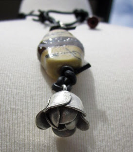 Cow bell artisan necklace by Honey from the Bee