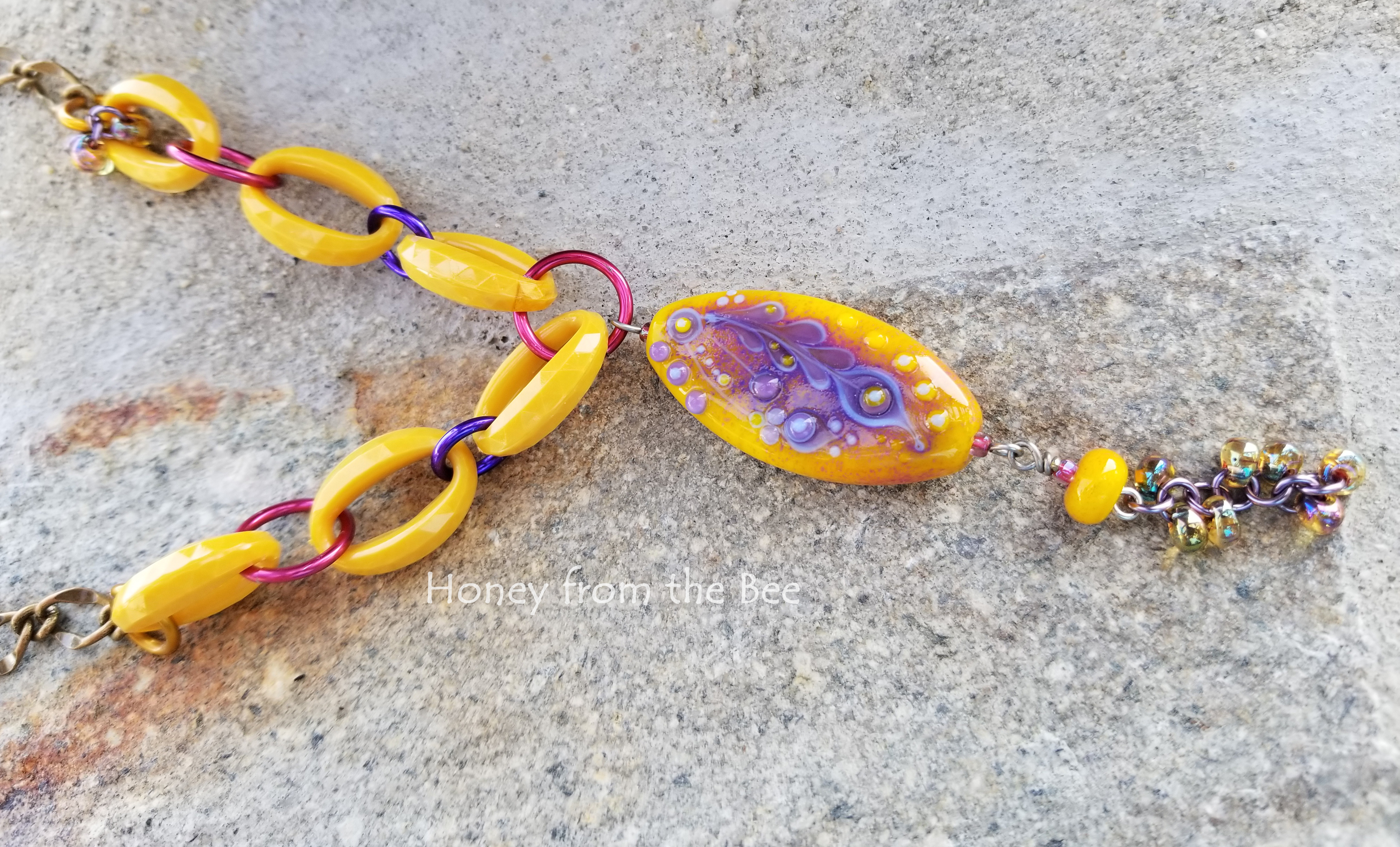 Vintage plastic with lampwork in yellow and purple necklace