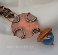Photo shows copper back of focal on this artisan pendant