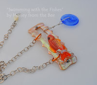 Orange lampwork fish and Mother of Pearl necklace
