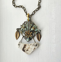Mixed Media art necklace features sea pottery, brass filigree and crystal