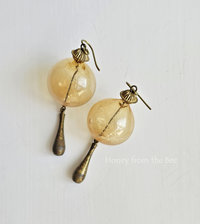 Statement earrings in yellow and aged brass