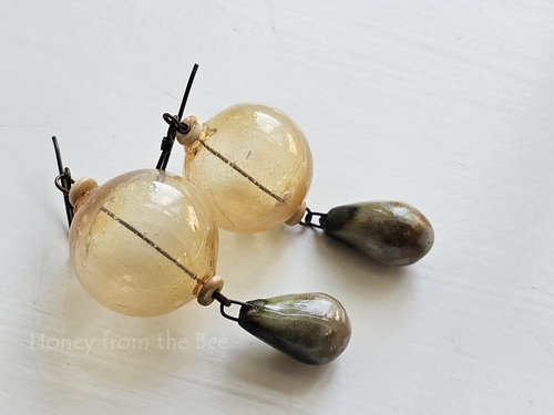Statement boho earrings in yellow and pale green