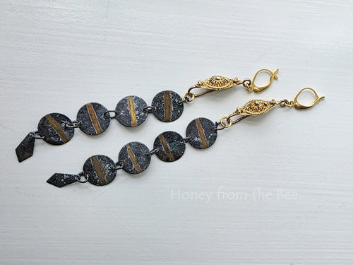 Shoulder duster length earrings in gold and green