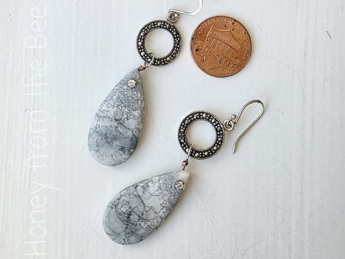 Teardrop earrings feature orbicular jasper and marcasite