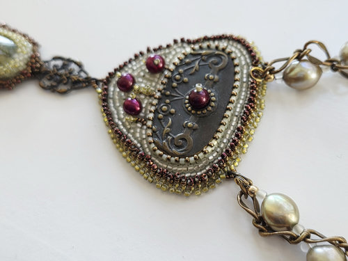 Bead embroidered statement necklace in brass, white, green and red