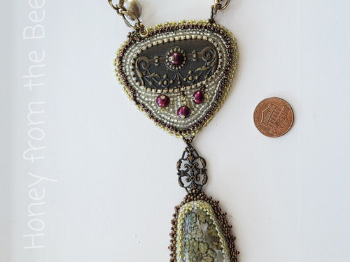 Statement necklace in brass and white and green