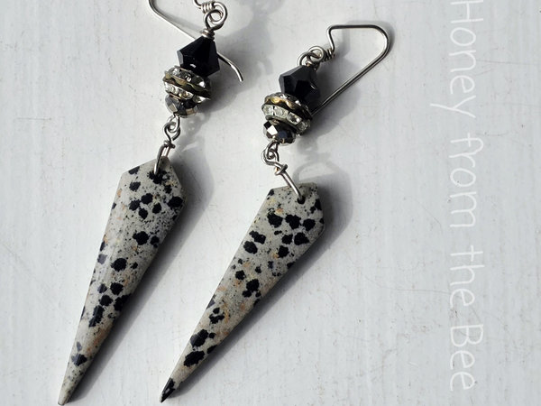 Evening earrings feature Dalmatian stone and crystals