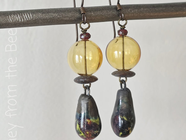Boho style earrings feature lampwork and ceramic