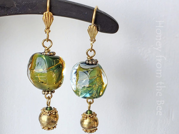 Green and gold earrings feature lampwork and vermeil