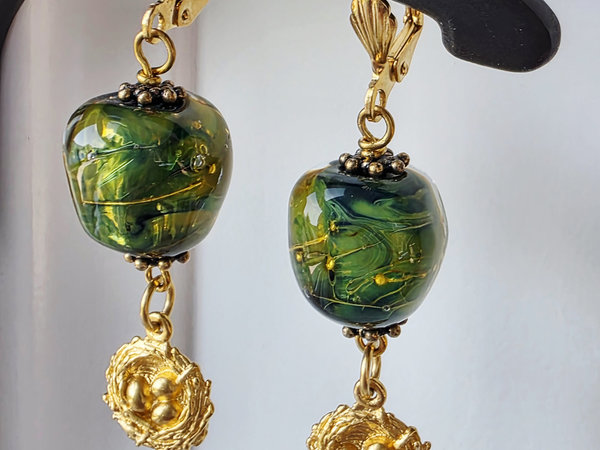 Green and gold earrings with bird's nest dangle