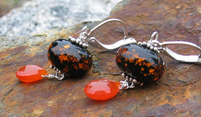 Orange and Black artisan earrings by Honey from the Bee