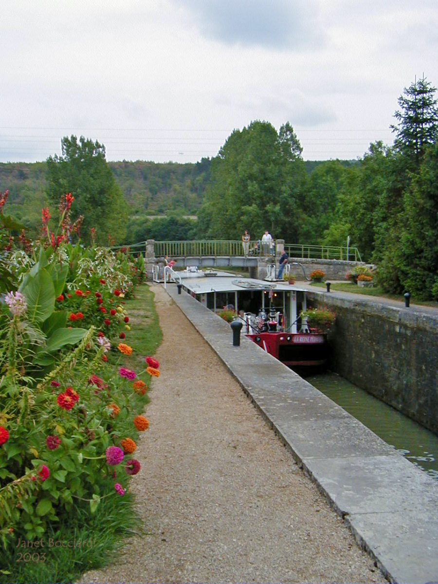 Barge going through lock on Canal de Bourgogne