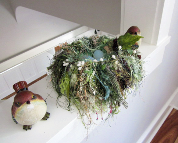 Indoor bird's nest with birds