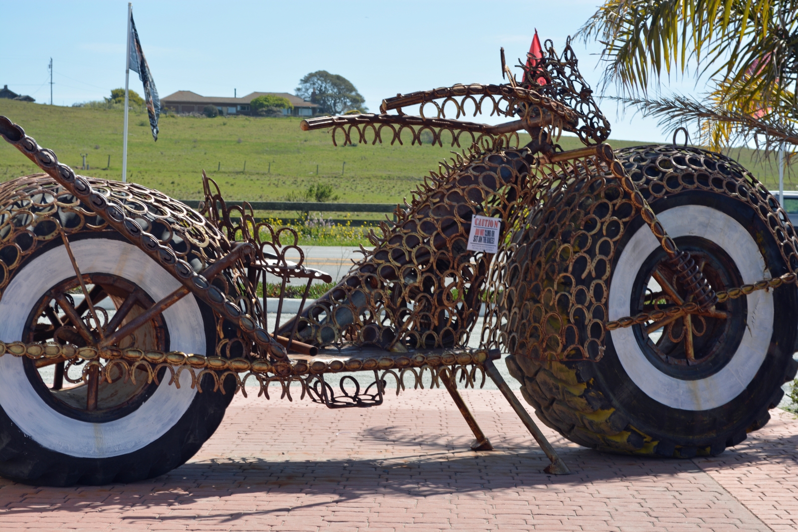 Motorcycle sculpture made from horseshoes