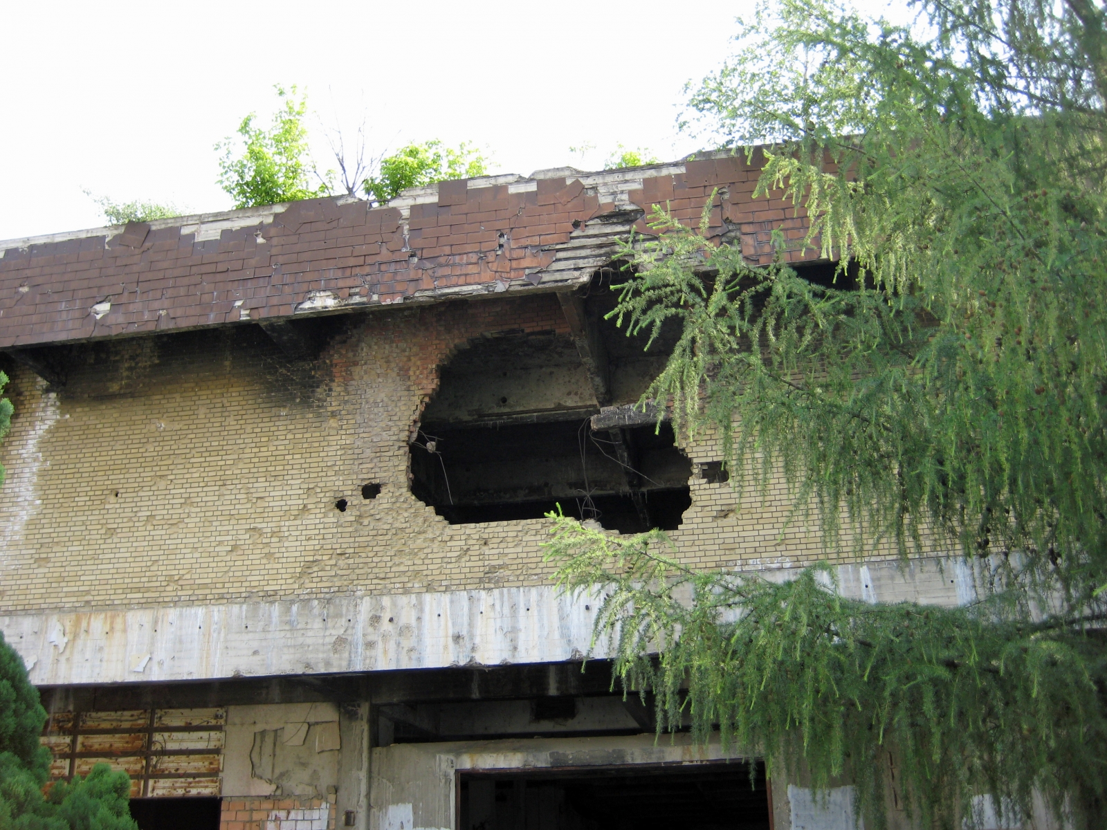 Large bomb hole in building, Vukovar, Croatia