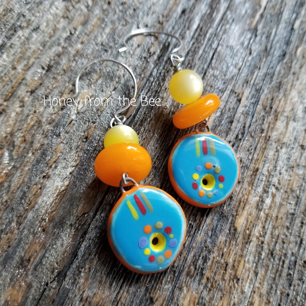 Bright orange and blue earrings