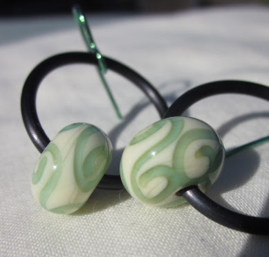 Green lampwork hoop earrings by Honey from the Bee