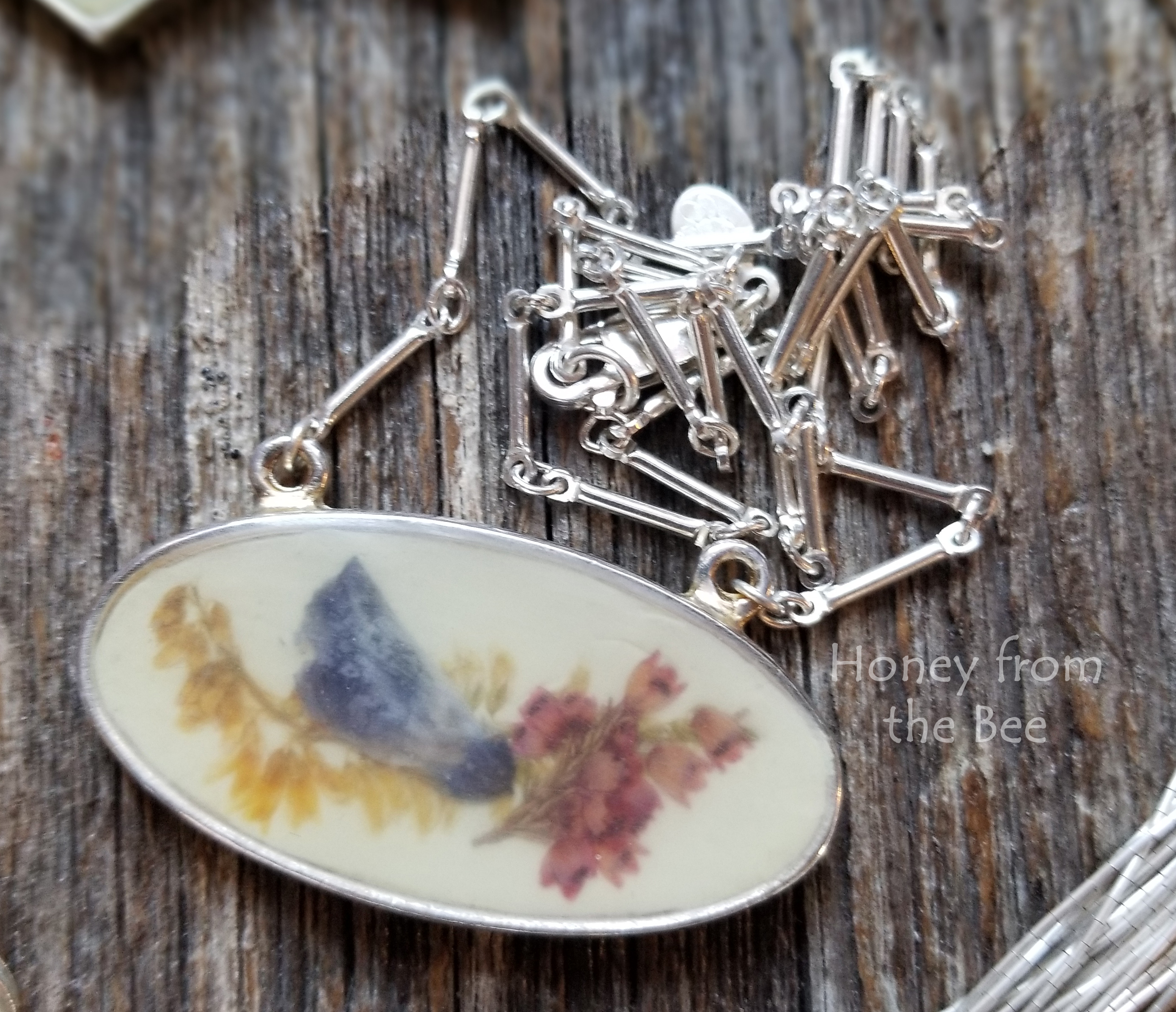 Dried flowers in resin necklace