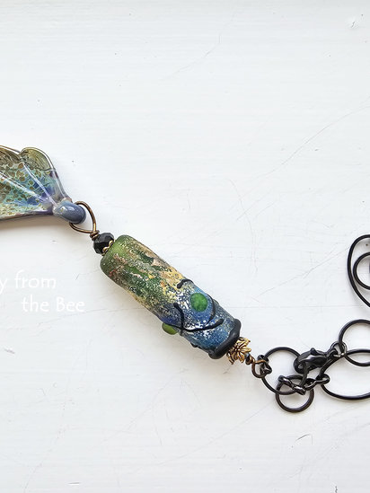 Always Growing pendant features lampwork