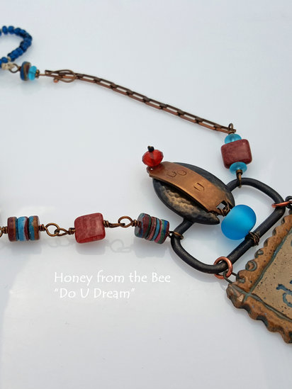Dream necklace features ceramic, antique buckle, fossilized coral agate and lampwork