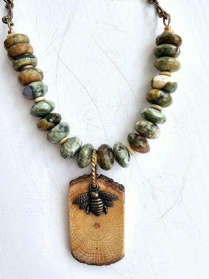 Inconvenient necklace features faceted Rainforest Jasper, wood, brass