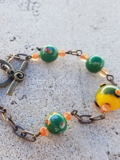 Mandarin bracelet features antique lampwork 