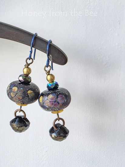 Night Lights earrings features lampwork and antique buttons