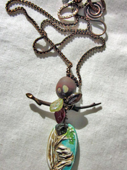 Seasons necklace features polymer, lampwork, brass and copper