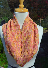 Yellow and pink knitted cowl