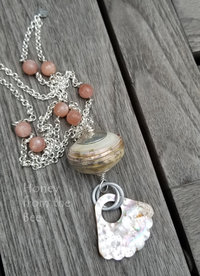 one of a kind peach and cream necklace