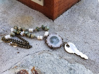 boho style artisan necklace with solar stalactite slice