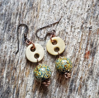 Vintage button earrings make this pair a unique find.