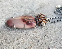Stunning Apache Sage stone echoes the facets of the sterling silver pinecone in this woodland pendant