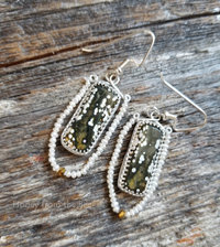 Green and white artisan earrings