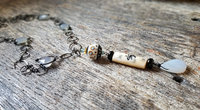 Long necklace in carved bone and chalcedony