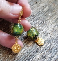 Green and gold earrings