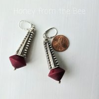 Statement earrings in dark red and silver