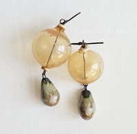 Yellow earrings feature hollow lampwork and ceramic drops