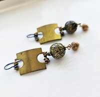 Brass and art glass earrings feature vintage brass tag with raku frit lampwork bead and a detailed brass acorn dangle.