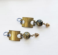 Earthtones and brass highlight this pair of artisan earrings.