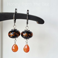 Carnelian earrings with black and orange lampwork
