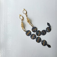 Shoulder duster earrings in gold and green