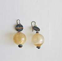 Boho earrings feature golden yellow lampwork and verdigris brass