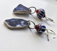 Cobalt blue sea pottery dangle from vintage African trade beads in red white and blue in this pair of casual earrings.