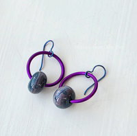 Hoop earrings in purple and teal