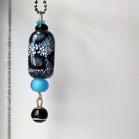 Lampwork pendant in blue and black with antique button