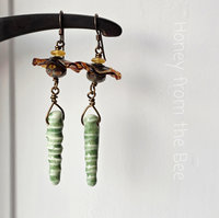 Yellow and green earrings in floral theme