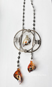 Butterfly statement necklace with orange and grey butterfly wings