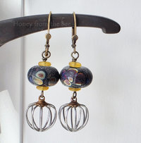 Raku lampwork earrings in black and yellow